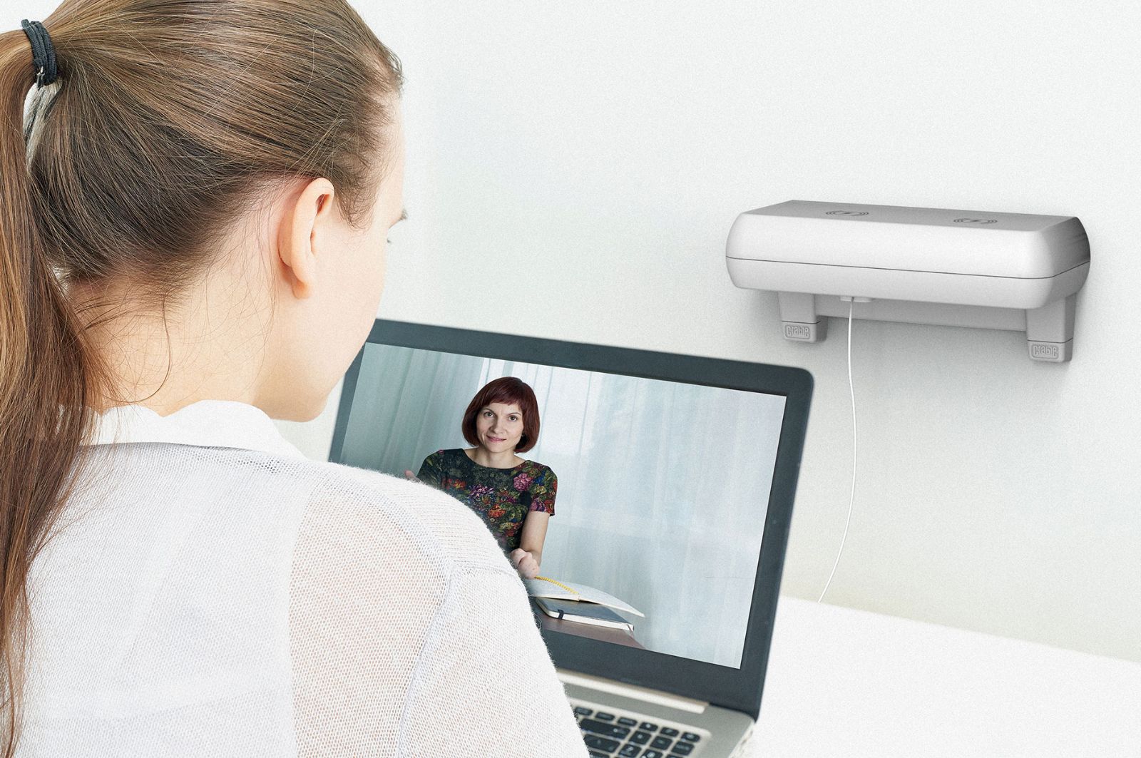 Office worker using Crable to charge their laptop